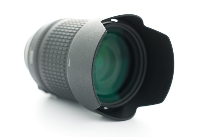 an image of a camera lens with hood