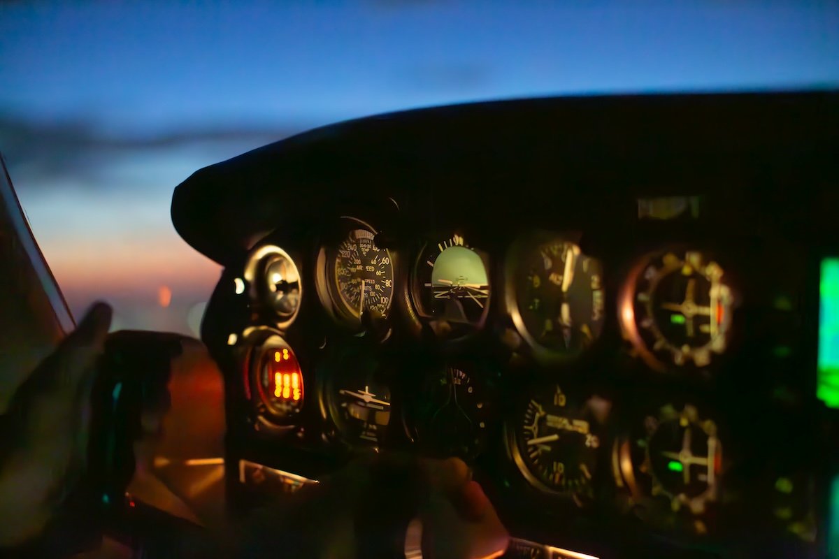 underexposed image of a cockpit at night edited in lightroom with added adjustments in the blacks