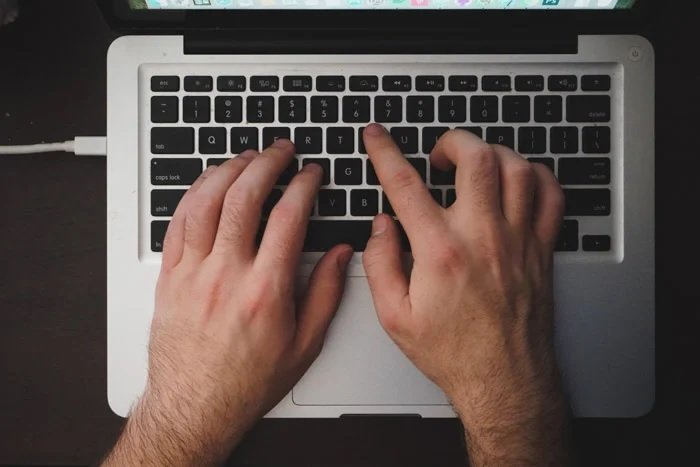 Hands using a computer keyboard