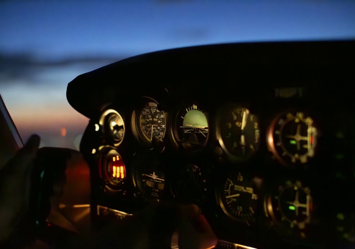 photograph of a cockpit of a plane at night with lightroom denoise