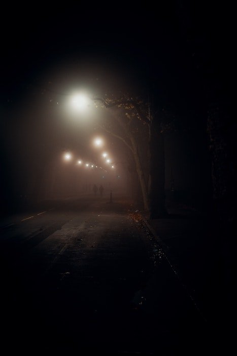 street lights create blur at night as an example of low light photography