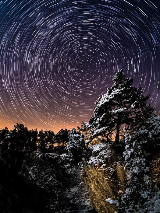 An impressive photo of star trails in the night sky
