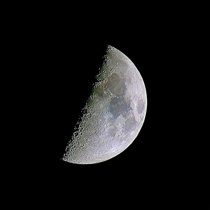 A half moon photo showing high detail of the surface and high contrast near the terminator