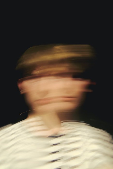 motion blur photoshop: A portrait of a person with motion blur