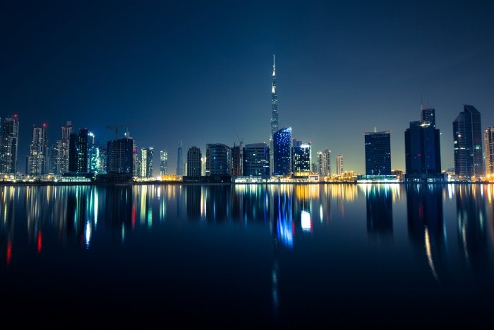 reflection of a city skyline at night 