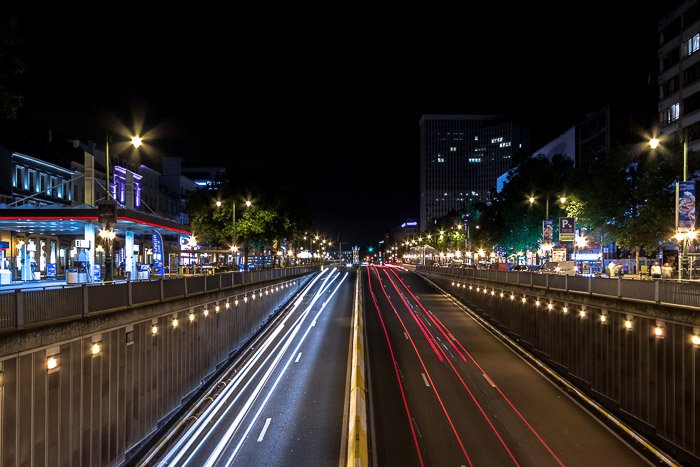 Streaming car light trails at Boulevard de Waterloo by night (Brussels, Belgium), motion blur photography