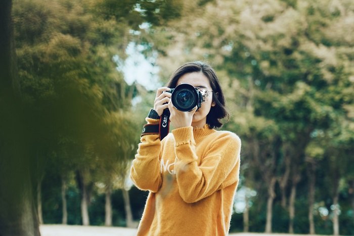 a photo of a woman taking a photo of the person who took this photo