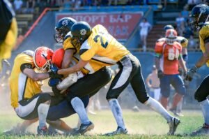 American football scrum to illustrate sports photography settings