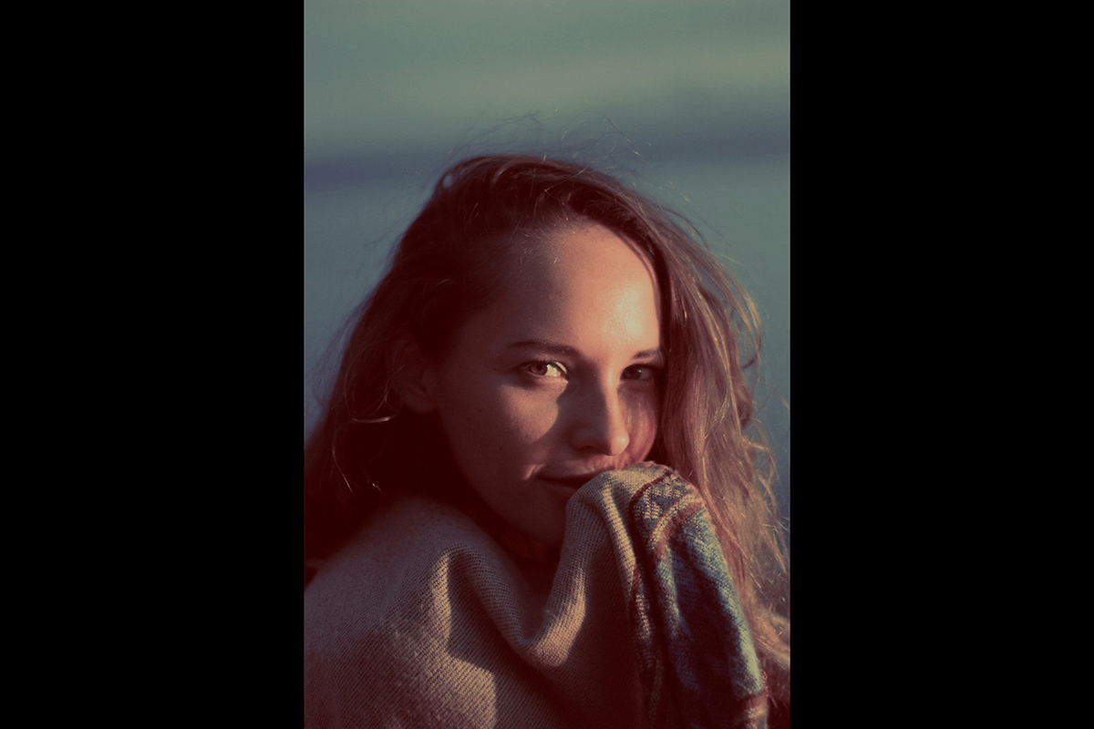 Headshot of a woman with a shallow depth of field and one eye out of focus