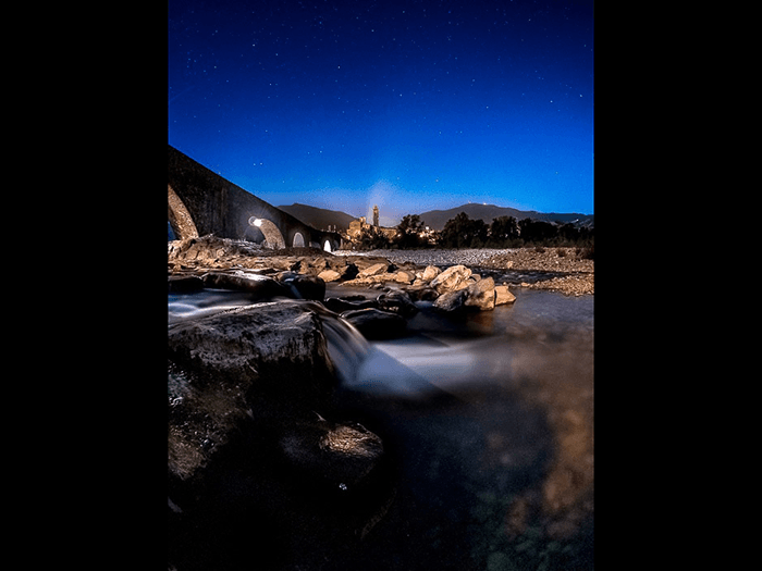 Silky motion blur in rapids under the Devils Bridge in Bobbio Italy